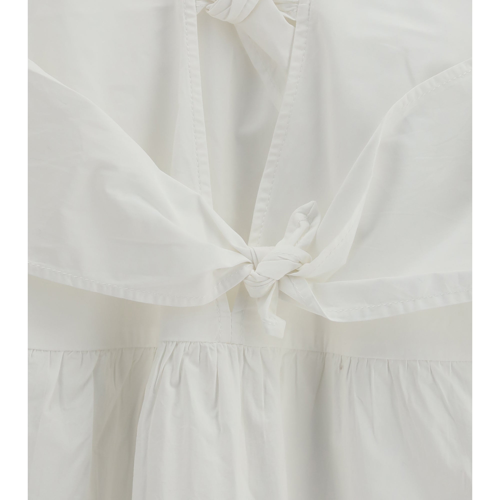Mini Dress with a deep V-neckline and front tie bands